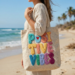 "Positivity Vibes" punch needle design featuring abstract floral elements embroidered on a linen canvas bag in dusty rose and cream